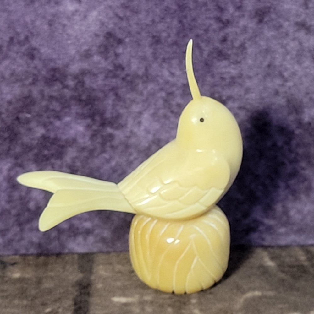 Handcarved Figurine Of A Bird Perched On A Base Crafted From Tagua Nut